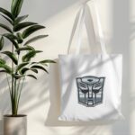 tote bag mockup hanging on white wall with plant in side 019 (1)