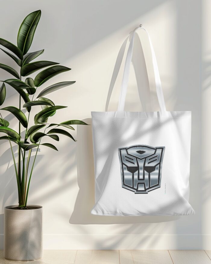 tote bag mockup hanging on white wall with plant in side 019 (1)